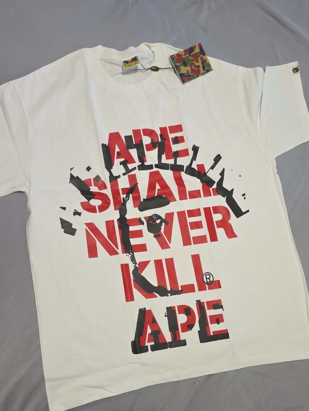 Bape White Tee with Red & Black 'APE SHALL NEVER KILL APE' Graphic